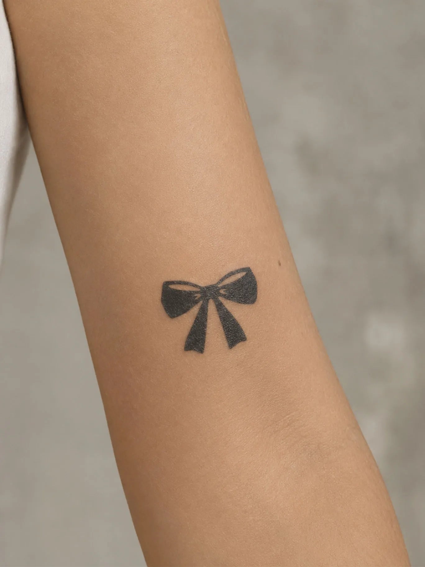 Bold Bow Tattoo